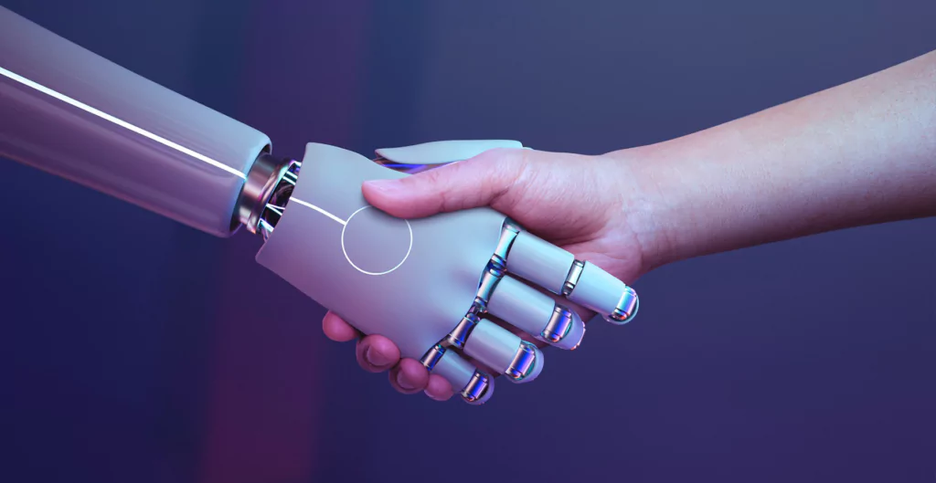 uma mão humana apertando a mão e um robô 